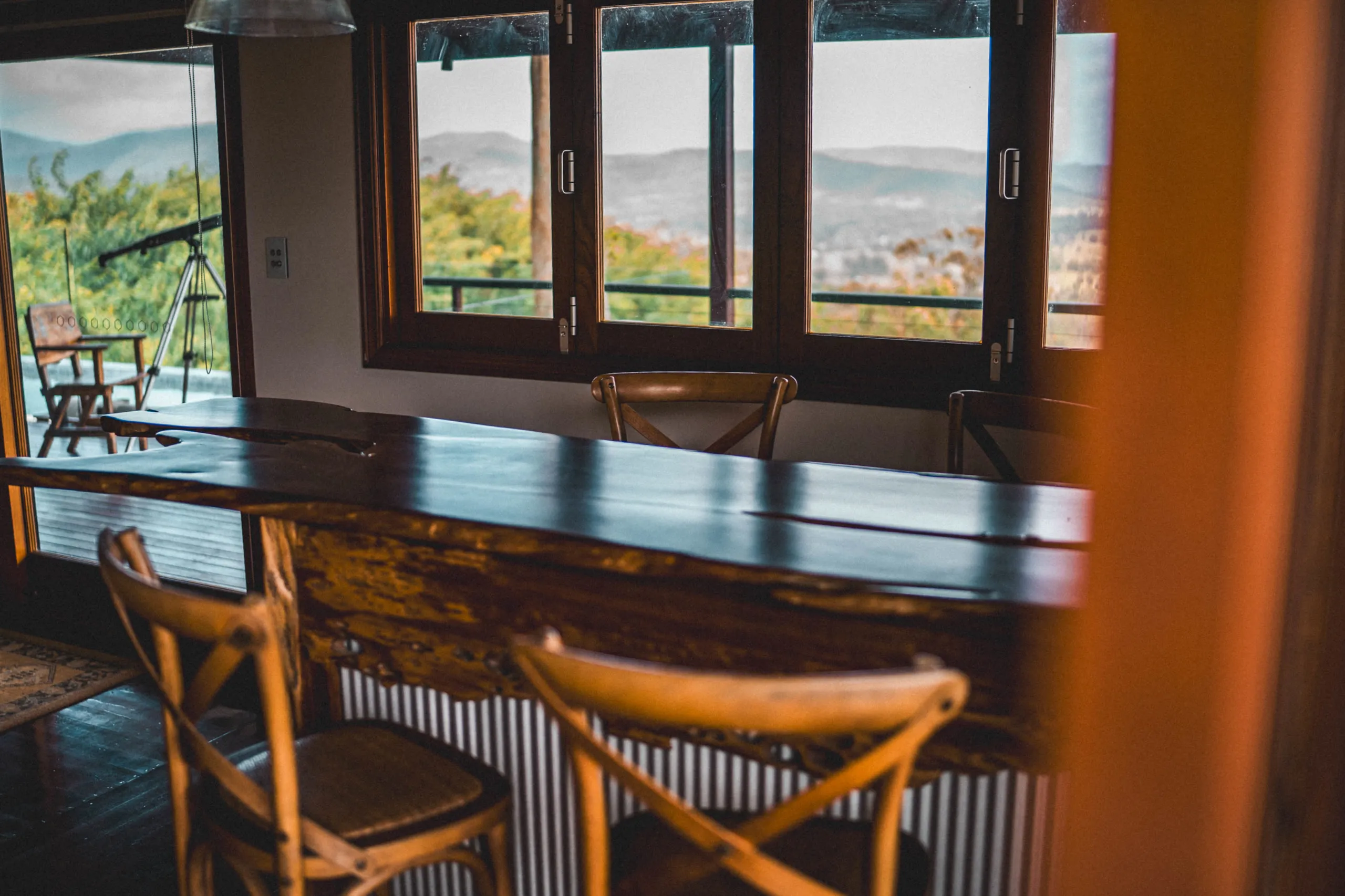 The indoor/outdoor bar, bifold windows open to the deck